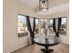 Well-lit dining area with a decorative floral arrangement and a charming round table at 2738 E Silversmith Trl, San Tan Valley, AZ 85143