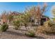 Desert landscaping complements this home, featuring hardy plants and decorative gravel at 2738 E Silversmith Trl, San Tan Valley, AZ 85143