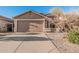 Charming single-story home with a two-car garage and neat desert landscaping at 2738 E Silversmith Trl, San Tan Valley, AZ 85143