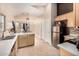 Spacious kitchen with modern appliances, light cabinets, and an attached dining area at 2738 E Silversmith Trl, San Tan Valley, AZ 85143