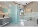 Bright, modern bathroom with dual vanities, glass enclosed shower, and a stylish, minimalist aesthetic at 28341 N 112Th Way, Scottsdale, AZ 85262