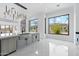 Bright kitchen with stainless steel appliances, farm sink, and large windows offers abundant natural light at 28341 N 112Th Way, Scottsdale, AZ 85262