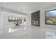 Open concept living space with dining area, fireplace, and large windows offers modern living at 28341 N 112Th Way, Scottsdale, AZ 85262