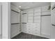 Spacious walk-in closet with custom shelving, drawers, and ample storage for an organized wardrobe at 28341 N 112Th Way, Scottsdale, AZ 85262