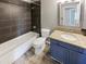 Contemporary bathroom boasts a granite vanity, tile floors, bathtub and tiled shower at 3134 E Mckellips Rd # 50, Mesa, AZ 85213