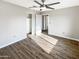 Bright bedroom with wood floors, closet and ceiling fan for added comfort and convenience at 3134 E Mckellips Rd # 50, Mesa, AZ 85213