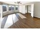 Bright bedroom with wood floors, plenty of natural light, and ceiling fan at 3134 E Mckellips Rd # 50, Mesa, AZ 85213