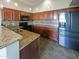 Kitchen featuring granite counters, stainless appliances, and mosaic backsplash at 3134 E Mckellips Rd # 50, Mesa, AZ 85213