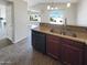 Kitchen featuring granite counters, stainless appliances, and large window at 3134 E Mckellips Rd # 50, Mesa, AZ 85213