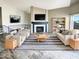 Bright living room featuring a fireplace, neutral paint, decorative rug, and modern furniture at 3134 E Mckellips Rd # 50, Mesa, AZ 85213