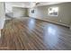 Open living room featuring wood floors, recessed lights, and backyard view, great for gatherings at 3134 E Mckellips Rd # 50, Mesa, AZ 85213