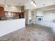 Spacious living room with a fireplace, desk, and kitchen access at 3134 E Mckellips Rd # 50, Mesa, AZ 85213