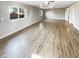 Spacious living room featuring wood floors and natural light, great for relaxing or entertaining at 3134 E Mckellips Rd # 50, Mesa, AZ 85213
