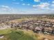 Expansive aerial view showcases homes situated around a beautiful golf course in a serene community at 3373 E Sports Dr, Gilbert, AZ 85298