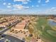 Scenic aerial view of a luxury community near a beautiful golf course and lake at 3373 E Sports Dr, Gilbert, AZ 85298