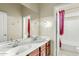 Bathroom features double sinks and a shower/tub combination at 3373 E Sports Dr, Gilbert, AZ 85298