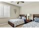 Comfortable bedroom decorated with two beds at 3373 E Sports Dr, Gilbert, AZ 85298