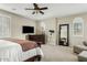 Bedroom with a telescope, dresser, ceiling fan, and shuttered windows to allow natural light at 3373 E Sports Dr, Gilbert, AZ 85298
