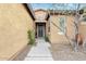 Inviting front entrance with stone accents, desert landscaping, and a secure front door at 3373 E Sports Dr, Gilbert, AZ 85298