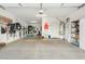 Spacious garage with ample storage, utility sink, and checkerboard flooring at 3373 E Sports Dr, Gilbert, AZ 85298