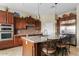 Beautiful kitchen featuring an island with seating, stainless steel appliances, and ample cabinet space at 3373 E Sports Dr, Gilbert, AZ 85298
