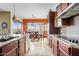 Modern kitchen boasts granite countertops, stainless steel appliances, and a view of the dining area at 3373 E Sports Dr, Gilbert, AZ 85298