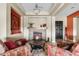 Inviting living room features a stone fireplace, comfortable seating, and elegant design at 3373 E Sports Dr, Gilbert, AZ 85298