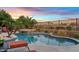 A resort-style pool and spa surrounded by lush landscaping and comfortable lounge chairs at 3373 E Sports Dr, Gilbert, AZ 85298