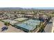 Overhead view showcasing multiple tennis and basketball courts within a beautifully landscaped community setting at 3373 E Sports Dr, Gilbert, AZ 85298