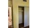 Bedroom closet with white sliding doors, a shelf, and the bathroom in the background at 355 E Thomas Rd # B207, Phoenix, AZ 85012