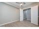 Bedroom with hard surface floors, neutral paint, and open doorway to other rooms at 36169 N Serrano Ave, Queen Creek, AZ 85140