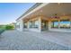 Outdoor covered patio and lush gravel backyard, perfect for relaxing and entertaining guests at 36169 N Serrano Ave, Queen Creek, AZ 85140
