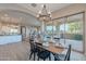 Open dining space with view to patio and kitchen features a modern table at 36169 N Serrano Ave, Queen Creek, AZ 85140