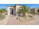 Inviting home entrance with a well-manicured yard and a charming walkway at 36169 N Serrano Ave, Queen Creek, AZ 85140