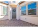 Welcoming entryway featuring a stylish front door and decorative wreath on a brick surface at 36169 N Serrano Ave, Queen Creek, AZ 85140