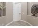 Bright entryway featuring modern decor, neutral walls, and stylish tile flooring at 36169 N Serrano Ave, Queen Creek, AZ 85140