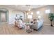 Open-concept living room with comfortable furniture, modern decor and lots of light at 36169 N Serrano Ave, Queen Creek, AZ 85140