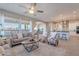 Inviting living room that opens to a modern kitchen with sleek countertops at 36169 N Serrano Ave, Queen Creek, AZ 85140
