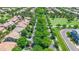 A tranquil aerial view of a community with lush tree-lined streets and well-maintained lawns at 3859 E Appaloosa Rd, Gilbert, AZ 85296