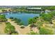 Scenic aerial view of a community pond surrounded by trees and walking paths at 3859 E Appaloosa Rd, Gilbert, AZ 85296