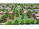 Aerial view of homes surrounding the large grassy area, some with mature trees and a playset at 3859 E Appaloosa Rd, Gilbert, AZ 85296