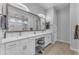 Modern bathroom with dual sinks, vanity area, and large mirror at 3859 E Appaloosa Rd, Gilbert, AZ 85296