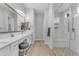 Luxurious bathroom featuring double sinks, marble countertops, and a large shower at 3859 E Appaloosa Rd, Gilbert, AZ 85296