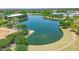 Aerial view featuring a community pond surrounded by lush greenery, offering serene views and walking trails at 3859 E Appaloosa Rd, Gilbert, AZ 85296