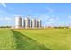 Idyllic farmland panorama showcasing grain silos against a backdrop of neighborhood homes at 3859 E Appaloosa Rd, Gilbert, AZ 85296
