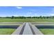 A landscaped walkway leads to a grassy expanse, a perfect spot for community enjoyment at 3859 E Appaloosa Rd, Gilbert, AZ 85296