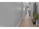 Bright hallway featuring neutral decor, wood-look flooring, and an open feel at 3859 E Appaloosa Rd, Gilbert, AZ 85296