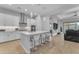 Open concept kitchen with a large island, pendant lighting, and direct view into the living room at 3859 E Appaloosa Rd, Gilbert, AZ 85296