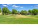 Community playground with slides, swings, and a covered picnic area, surrounded by green space at 3859 E Appaloosa Rd, Gilbert, AZ 85296