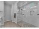 Stylish shower with mosaic tile floor, glass enclosure and marble surround at 3859 E Appaloosa Rd, Gilbert, AZ 85296